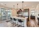 Modern kitchen with stainless steel appliances, and stylish bar seating overlooking a balcony at 2446 W 167Th Ln, Broomfield, CO 80023