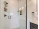 Modern walk-in shower with subway tile, black fixtures, and a sleek glass door, creating a spa-like experience at 2446 W 167Th Ln, Broomfield, CO 80023