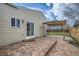 Brick patio with pergola. Sliding door leads to the home's interior at 5587 S Simms Way, Littleton, CO 80127