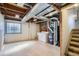 Spacious unfinished basement with laundry, utilities, and potential for customization at 5587 S Simms Way, Littleton, CO 80127