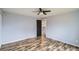 Bedroom with a ceiling fan and wood-look floors at 5587 S Simms Way, Littleton, CO 80127