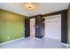 Bedroom featuring green walls and closet at 5587 S Simms Way, Littleton, CO 80127