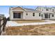 Backyard of home showing the patio and rear exterior of the home at 9693 Ceylon St, Commerce City, CO 80022
