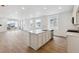 Modern kitchen with island, stainless steel appliances, and abundant natural light at 9693 Ceylon St, Commerce City, CO 80022