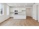 Bright kitchen with stainless steel appliances, white cabinets, and an island for casual dining at 9693 Ceylon St, Commerce City, CO 80022