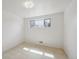 Well-lit bedroom with neutral carpet and a window providing natural light at 10830 Claire Ln, Northglenn, CO 80234