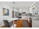 Bright kitchen with stainless steel appliances, white cabinetry, granite countertops, and a cozy breakfast nook at 10830 Claire Ln, Northglenn, CO 80234