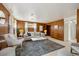 Comfortable living room with stylish seating, wood paneled walls, and ample lighting at 10830 Claire Ln, Northglenn, CO 80234