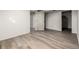 Finished basement bedroom with closet and flooring at 1502 S Queen St, Denver, CO 80232