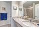 Bathroom featuring a tiled countertop, single vanity, and shower with light grey tiling at 28428 E 8Th Pl, Watkins, CO 80137