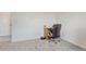 Bright room featuring neutral carpet, complemented by a wood desk and rolling brown leather chair at 28428 E 8Th Pl, Watkins, CO 80137