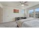 Bedroom with neutral color palette, ceiling fan, and carpeted floors at 28428 E 8Th Pl, Watkins, CO 80137