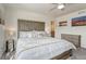 Cozy bedroom featuring a stylish headboard and gray carpeting at 28428 E 8Th Pl, Watkins, CO 80137