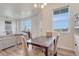 Open dining area with natural light, neutral decor, and seamless access to the living space at 28428 E 8Th Pl, Watkins, CO 80137