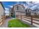 Charming two-story home with gray siding, a two-car garage, and a nicely landscaped front yard at 28428 E 8Th Pl, Watkins, CO 80137
