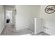 Upstairs hallway featuring gray carpet and white walls at 28428 E 8Th Pl, Watkins, CO 80137