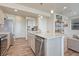 Modern kitchen featuring an island with granite countertops, stainless steel appliances, and ample cabinet space at 28428 E 8Th Pl, Watkins, CO 80137