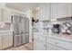 Kitchen featuring stainless steel refrigerator and granite counters at 28428 E 8Th Pl, Watkins, CO 80137
