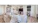 Cozy living room showcasing a plush gray sofa, hardwood floors, and decorative accents at 28428 E 8Th Pl, Watkins, CO 80137