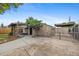 The home's backyard offers an updated storage area, fencing, and shade at 530 S Quitman St, Denver, CO 80219