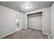 Inviting bedroom featuring a closet and doorway, ideal for rest and relaxation at 530 S Quitman St, Denver, CO 80219