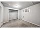 Cozy bedroom with a closet and window air conditioner, providing a comfortable and private space at 530 S Quitman St, Denver, CO 80219