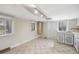 Spacious eat-in kitchen with tile flooring, vintage cabinets, and plenty of sunlight at 530 S Quitman St, Denver, CO 80219