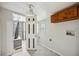 Functional laundry room featuring a washer/dryer hookups and a view into an adjacent bathroom at 530 S Quitman St, Denver, CO 80219