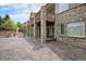 Brick home backyard with an open patio and upper level balcony with brick columns at 5924 S Kittredge St, Centennial, CO 80016