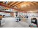 Unfinished basement with exposed beams, high ceilings, and open layout at 5924 S Kittredge St, Centennial, CO 80016