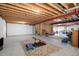 Spacious unfinished basement area with exposed ceiling and concrete flooring at 5924 S Kittredge St, Centennial, CO 80016