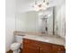 Half bath features a vanity and large mirror at 5924 S Kittredge St, Centennial, CO 80016