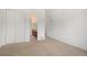 Neutral bedroom showcasing double closets and an ensuite bathroom at 5924 S Kittredge St, Centennial, CO 80016