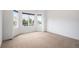 Spacious bedroom features large windows offering natural light and neutral carpeting at 5924 S Kittredge St, Centennial, CO 80016