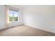 Cozy bedroom with neutral carpet, large window with curtain, and view at 5924 S Kittredge St, Centennial, CO 80016