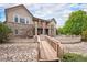 Stunning home features a stone and stucco facade, multiple decks, and beautiful landscaping at 5924 S Kittredge St, Centennial, CO 80016