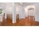 Elegant foyer with hardwood floors, an arched entrance, and a stylish chandelier fixture at 5924 S Kittredge St, Centennial, CO 80016