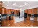 Spacious kitchen with wood cabinets, granite countertops, and stainless steel appliances at 5924 S Kittredge St, Centennial, CO 80016