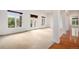 Open living room with carpet flooring, large windows, and access to an outdoor deck at 5924 S Kittredge St, Centennial, CO 80016
