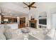 Cozy living room with a fireplace, open layout, and seamless access to the kitchen area at 5924 S Kittredge St, Centennial, CO 80016