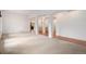 Bright and open living room with hardwood floors, archways, and a view into other rooms at 5924 S Kittredge St, Centennial, CO 80016