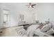 Bright main bedroom featuring access to a private balcony and comfortable seating area at 5924 S Kittredge St, Centennial, CO 80016
