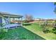 Spacious backyard featuring a patio, grass area, and gardens perfect for relaxing, play, and outdoor activities at 1796 S Yampa Way, Aurora, CO 80017