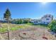 Vast backyard with garden beds and some grass, offering a serene and private outdoor space to be enjoyed at 1796 S Yampa Way, Aurora, CO 80017