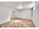 Unfinished basement with wood-look flooring and a support beam at 1796 S Yampa Way, Aurora, CO 80017