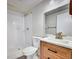 Updated bathroom features a walk-in shower and a modern vanity with great counter space for modern convenience at 1796 S Yampa Way, Aurora, CO 80017