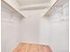 Walk-in closet with shelving and a wooden clothes bar, offering ample storage space at 1796 S Yampa Way, Aurora, CO 80017