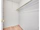 Walk-in closet space with a shelf and wooden bar for optimal storage at 1796 S Yampa Way, Aurora, CO 80017