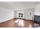 Inviting entryway boasting hardwood floors, a large window, and a staircase leading to the upper level at 1796 S Yampa Way, Aurora, CO 80017