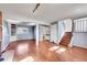 Open living space with hardwood floors, a view to a stairway, and an open floor plan at 1796 S Yampa Way, Aurora, CO 80017